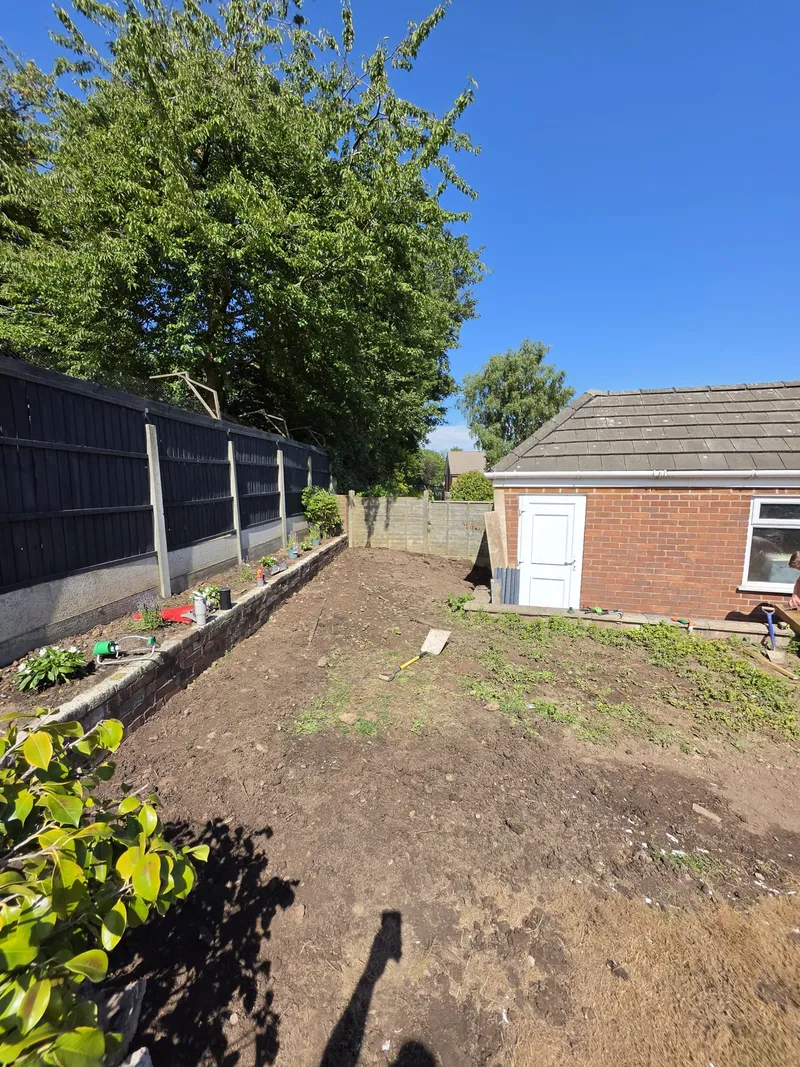 Overgrown Runcorn garden being cleared before a new lawn is laid